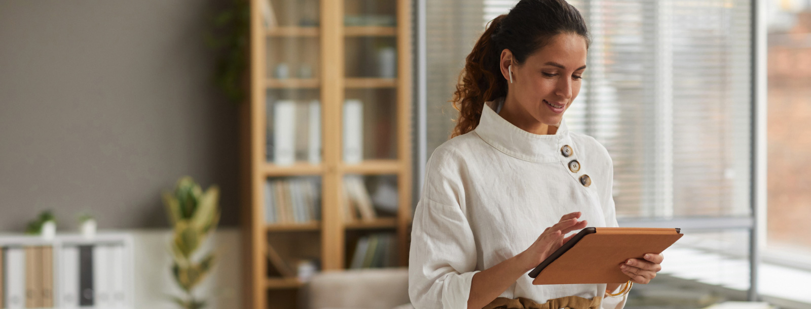 Female business owner working on tablet