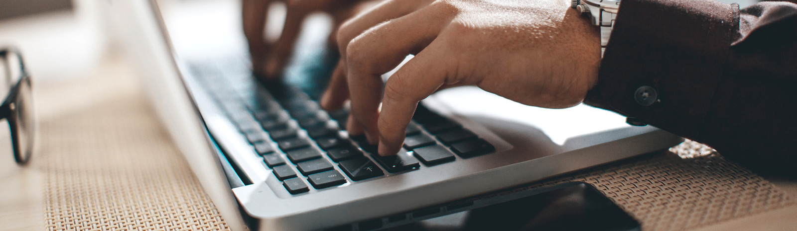 Man typing on computer