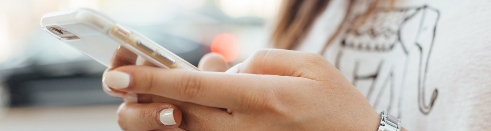 Close up of woman using smartphone