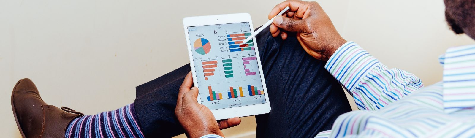 man holding tablet going over finances