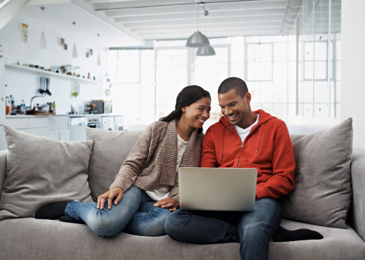 Young couple looking at laptop